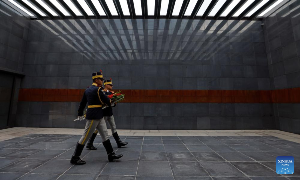 Romanian soldiers carry a wreath during ceremonies marking the European Roma Holocaust Memorial Day at a Holocaust memorial in Bucharest, Romania, July 31, 2025. (Photo by Cristian Cristel/Xinhua)