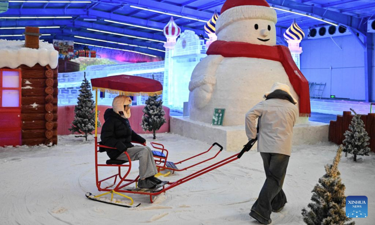 People have fun at an indoor snow and ice world in Huaian, east China's Jiangsu Province, July 15, 2025. An indoor snow and ice world, established at Jinhu water forest scenic spot in Huaian, provides tourists with a refreshing experience in summer. (Xinhua/Ji Chunpeng)