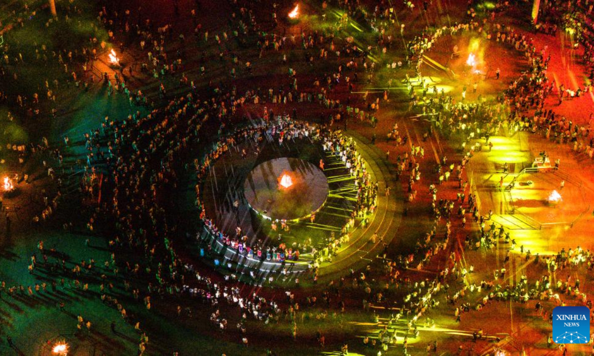 An aerial drone photo shows people celebrating the Torch Festival of Yi ethnic group in Shuicheng District of Liupanshui, southwest China's Guizhou Province, July 18, 2025. Celebrations for the Torch Festival of Yi ethnic group kicked off on Friday at a tourist resort in Shuicheng District of Liupanshui, attracting tourists from across the country. A series of related activities will also take place here on or before Aug. 17. (Xinhua/Tao Liang)