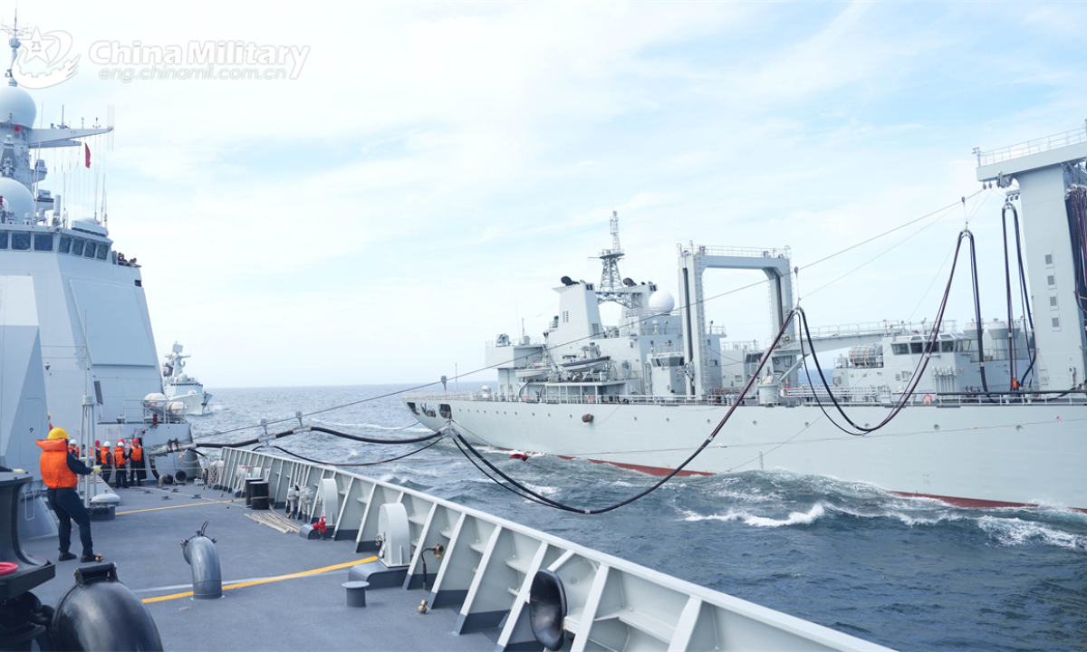 Warships attached to a flotilla with the navy under the Chinese PLA Eastern Theater Command conduct alongside replenishment at sea during a live-fire training exercise. (eng.chinamil.com.cn/Photo by Li Jinbiao and Shen Yang)