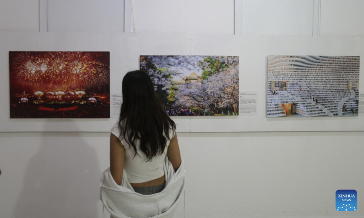 A visitor views exhibits at the China Story photo exposition held in Tlalnepantla, Mexico, July 5, 2025. The China Story photo exposition, which kicked off here on Saturday, showcases 40 groups of images revealing the beauty of Chinese landscapes and the depth of Chinese culture, offering local audiences a vivid window into modern China. (Photo by Francisco Canedo/Xinhua)