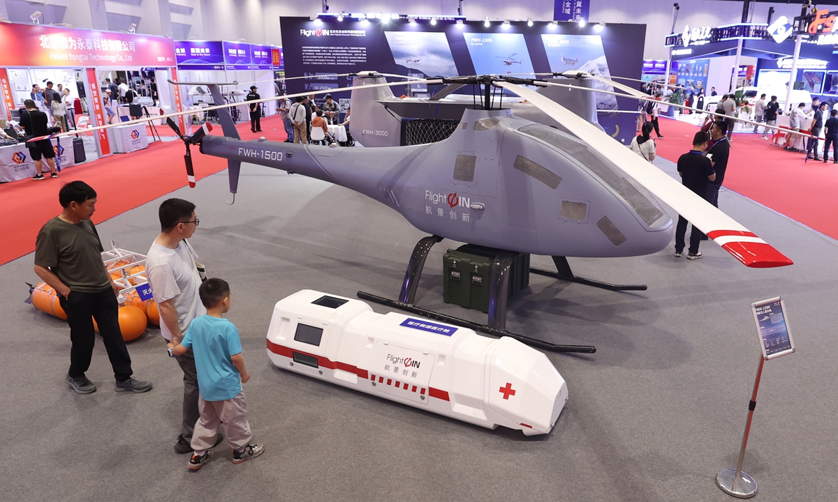 Visitors view a ton-class unmanned helicopter at the 6th China International UAV and Unmanned Systems Expo, held from July 5 to 7, 2025 at the China National Convention Center in Beijing. More than 500 exhibitors are showcasing cutting-edge technologies and key components, including complete UAV systems, counter-drone technologies, and low-altitude economy equipment.
Photo: VCG