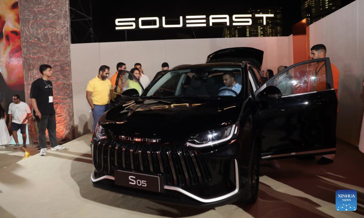 Guests try a SOUEAST's new model during a launch in El Alamein, Egypt, on July 24, 2025. SOUEAST, a Chinese auto brand, unveiled four new models in Egypt on Thursday, marking a significant expansion in the African market. (Xinhua/Sui Xiankai)