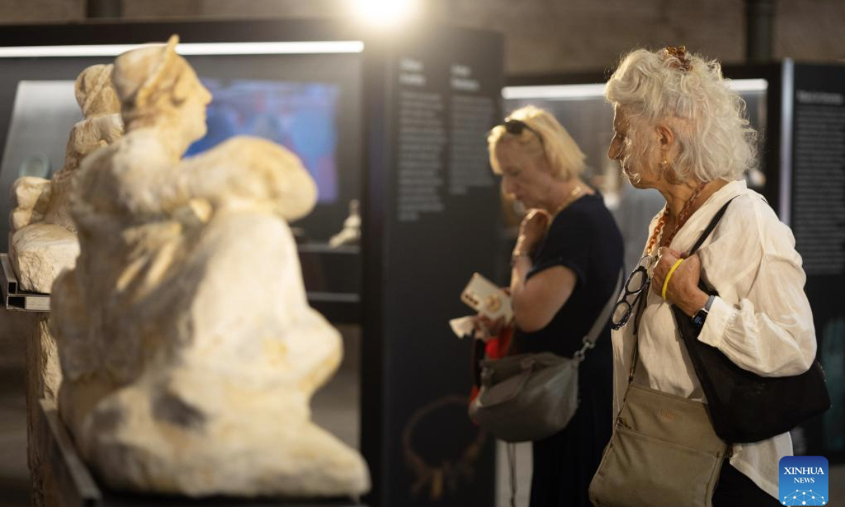 Visitors look at the exhibits at the Museum of Rescued Art in Rome, Italy, July 24, 2025. The Museum of Rescued Art, part of the National Roman Museum network, reopened in June, showcasing over a hundred lost Italian antiquities recovered over the past three years by Italy's renowned art protection unit. (Xinhua/Li Jing)
