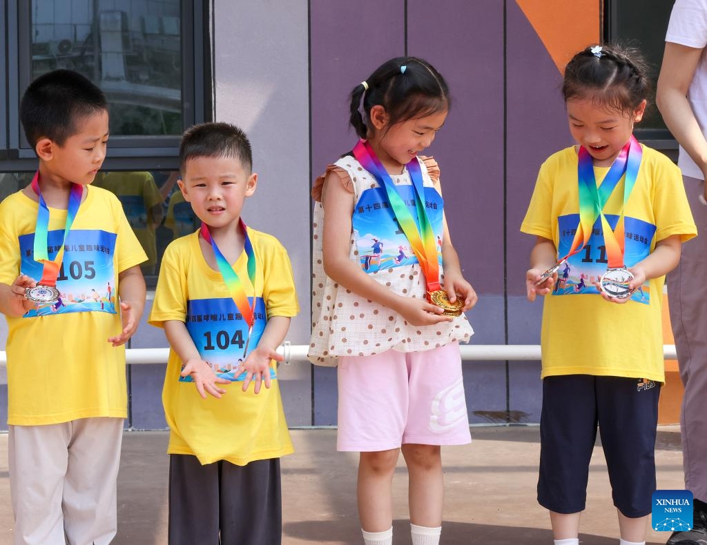 Children show their medals won at the competition in Beijing, capital of China, July 5, 2025. A sports meeting for children with asthma was held here on Saturday. (Photo: Xinhua)