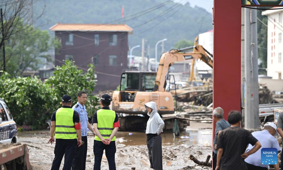 Emergency workers are on duty at Xiaying Village of Xiaying Town, Jizhou District of north China's Tianjin, July 28, 2025. Houses, bridges and power lines at part of villages in Jizhou District were damaged by floods inflicted by recent heavy rainfall and upstream runoff.

Local emergency operations including search and rescue, evacuee transfer, and disaster relief are orderly going on. (Xinhua/Li Ran)