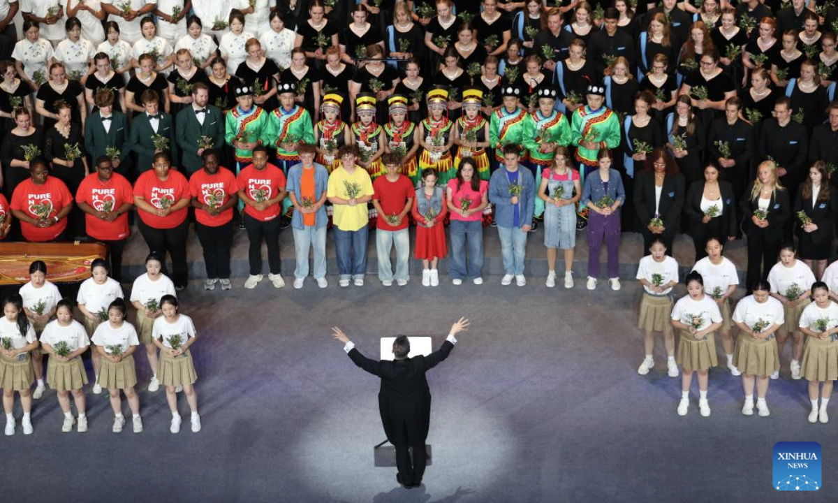 Teenagers from China and the United States sing during a performance at China National Opera House in Beijing, capital of China, July 16, 2025. A closing performance of Bond with Kuliang: 2025 China-U.S. Youth Choir Festival, with the theme of Singing for Peace, was staged in Beijing on Wednesday. (Xinhua/Lu Ye)
