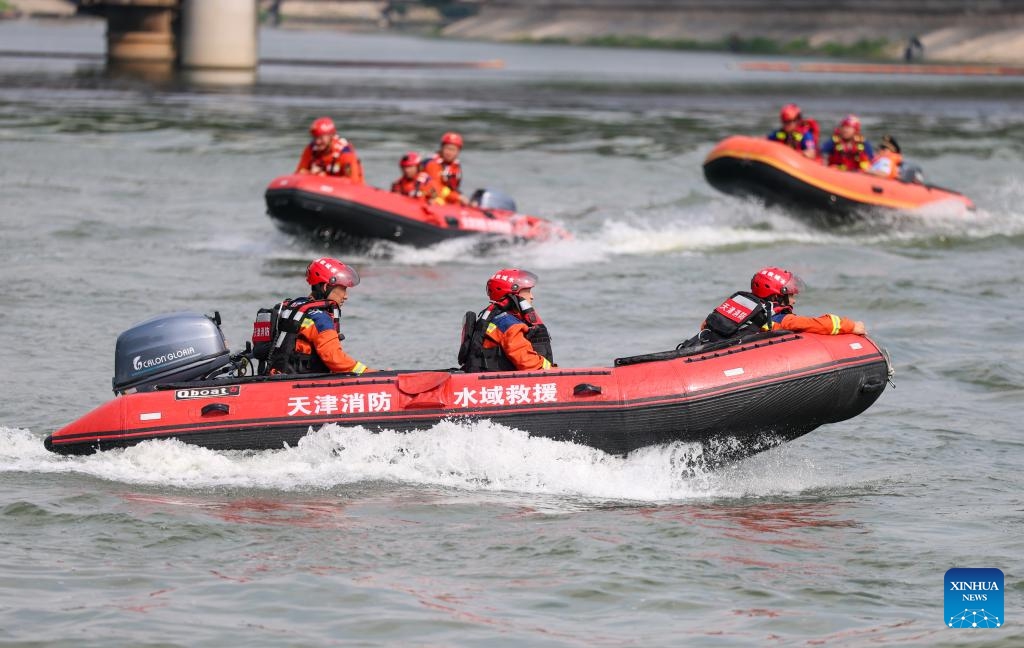 Rescuers participate in a flood rescue drill on Haihe River in north China's Tianjin, on July 5, 2025. The drill was set against potential flooding in culverts and low-lying urban areas affected by heavy rainfall. (Photo: Xinhua)