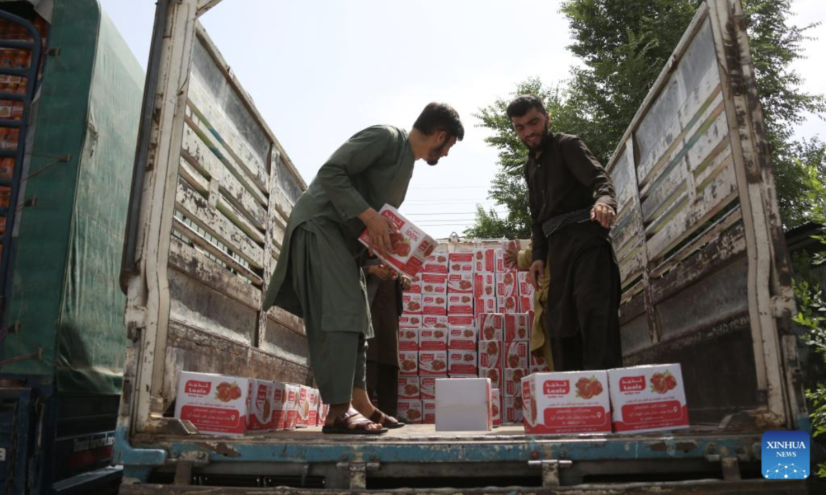 Workers load expired and low-quality food items in Kabul, the capital of Afghanistan, July 15, 2025. Afghan authorities collected and destroyed 65 tons of expired and low-quality food items in the capital Kabul on Tuesday, officials from the Ministry of Public Health said. (Photo by Saifurahman Safi/Xinhua)