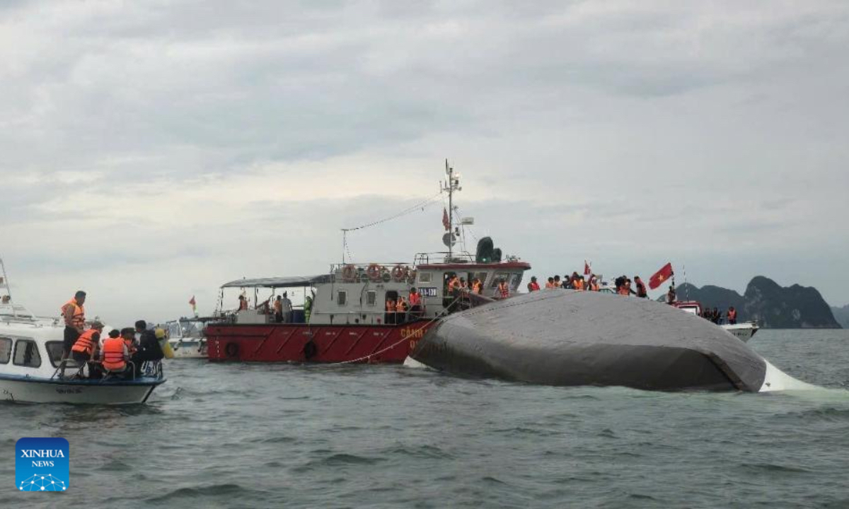 Rescuers work at the capsizing site of a cruise ship in Ha Long Bay, northern Vietnam's Quang Ninh province, July 19, 2025. At least three people have been confirmed dead and 10 others rescued after a cruise ship capsized in Ha Long Bay, northern Vietnam's Quang Ninh province, on Saturday afternoon, due to strong wind and rough sea, Vietnam News Agency reported. (VNA/Handout via Xinhua)