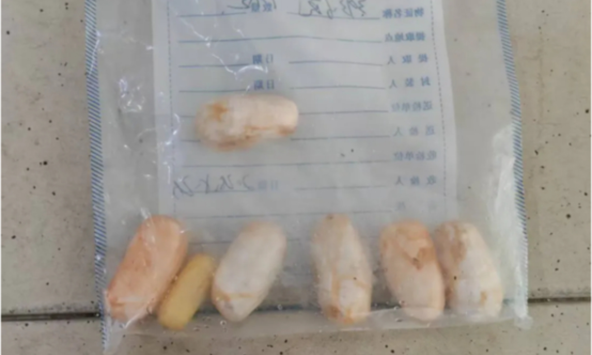 The 7 drug pellets expelled by the man Photo: General Administration of Customs