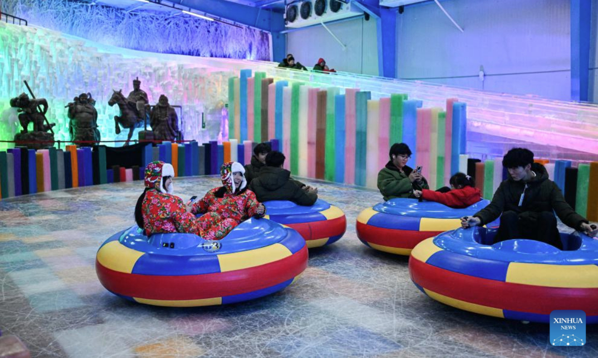 People have fun at an indoor snow and ice world in Huaian, east China's Jiangsu Province, July 15, 2025. An indoor snow and ice world, established at Jinhu water forest scenic spot in Huaian, provides tourists with a refreshing experience in summer. (Xinhua/Ji Chunpeng)