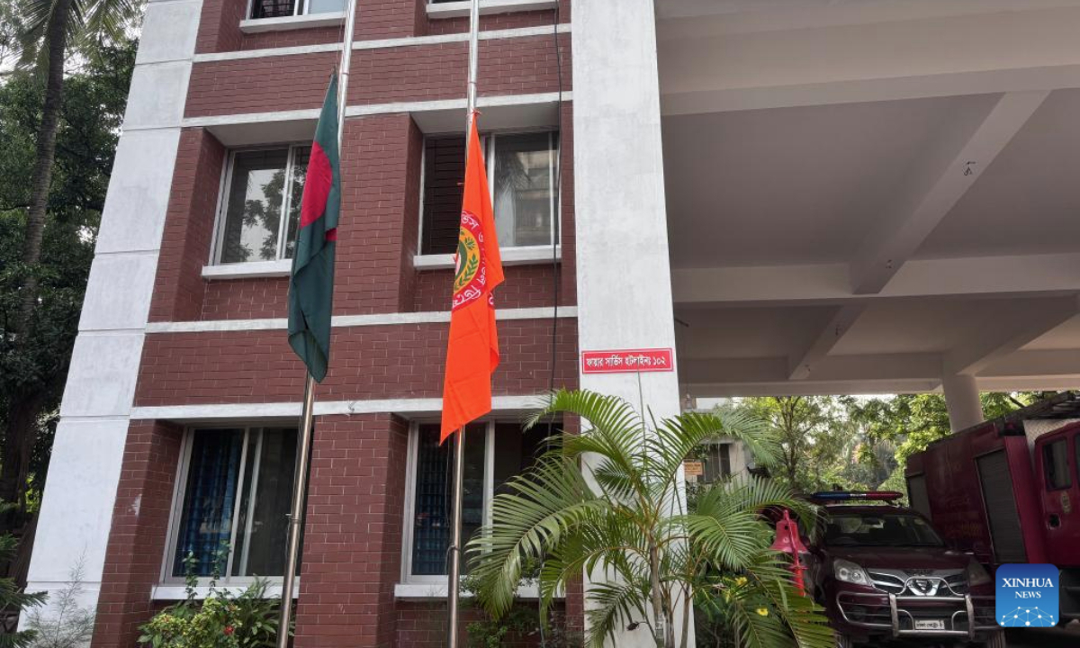 This photo taken on July 22, 2025 shows flags lowered to half-mast outside a fire service and civil defense station in Dhaka, Bangladesh. The death toll from Monday's crash of a Bangladesh Air Force training aircraft hit 31 on Tuesday, the Inter Service Public Relations (ISPR) of the Bangladesh Army said in a statement.

The Bangladeshi government is observing a national day of mourning on Tuesday following the jet crash. As part of marking the day, the national flags have been flown at half-mast at all government, semi-government, autonomous bodies, and educational institutions across the country, as well as at Bangladeshi missions overseas. (Photo by Habibur Rahman/Xinhua)