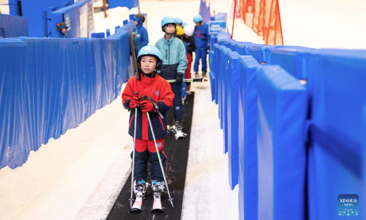 People ski at an indoor ski resort in Changsha, central China's Hunan Province, July 17, 2025. Built 36 meters underground, the indoor ski resort provides an escape for its visitors during summer. (Xinhua/Chen Sihan)