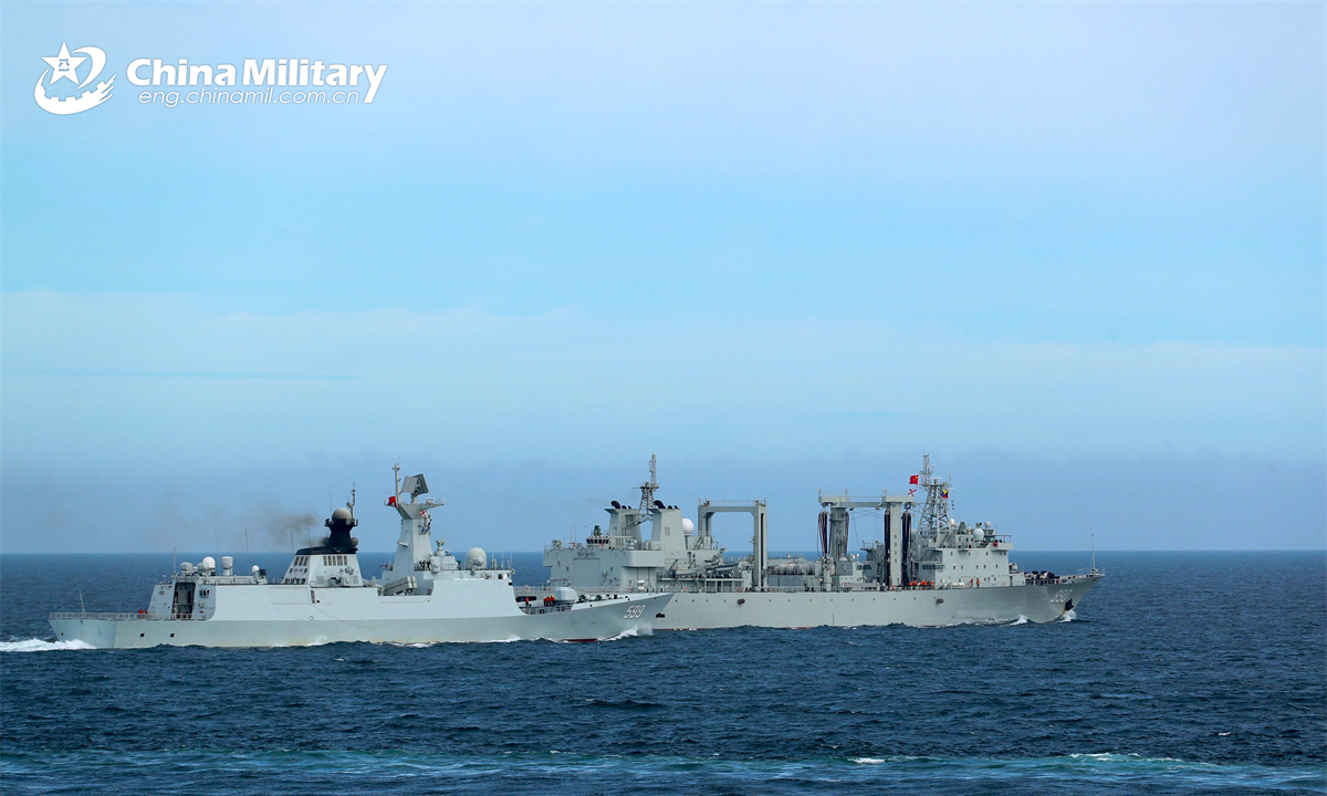 Frigate Anyang (Hull 599) attached to a flotilla with the navy under the Chinese PLA Eastern Theater Command approaches the comprehensive supply ship Chaohu (Hull 890) for alongside replenishment at sea during a live-fire training exercise. (eng.chinamil.com.cn/Photo by Li Jinbiao and Shen Yang)