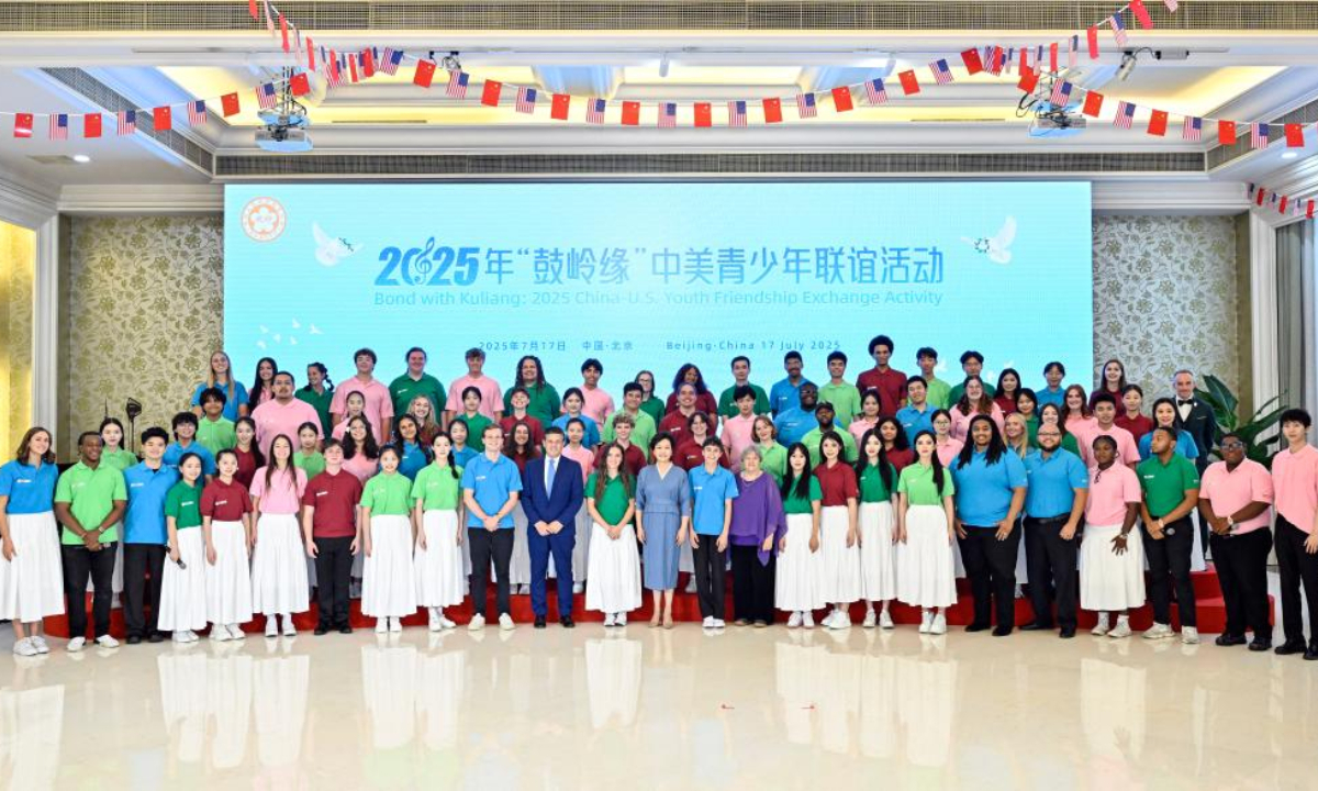 Peng Liyuan, wife of Chinese President Xi Jinping, poses for a group photo during the Bond with Kuliang: 2025 China-U.S. youth friendship event on July 17, 2025. Peng on Thursday attended the event and delivered a speech at the Chinese People's Association for Friendship with Foreign Countries. (Xinhua/Yin Bogu)