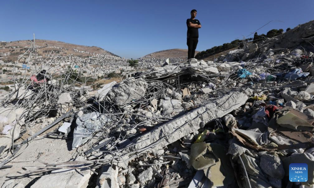 A Palestinian inspects the rubble of a house demolished by an Israeli excavator, in the town of Rujeib, east of the West Bank city of Nablus, on July 9, 2025. (Photo by Nidal Eshtayeh/Xinhua)
