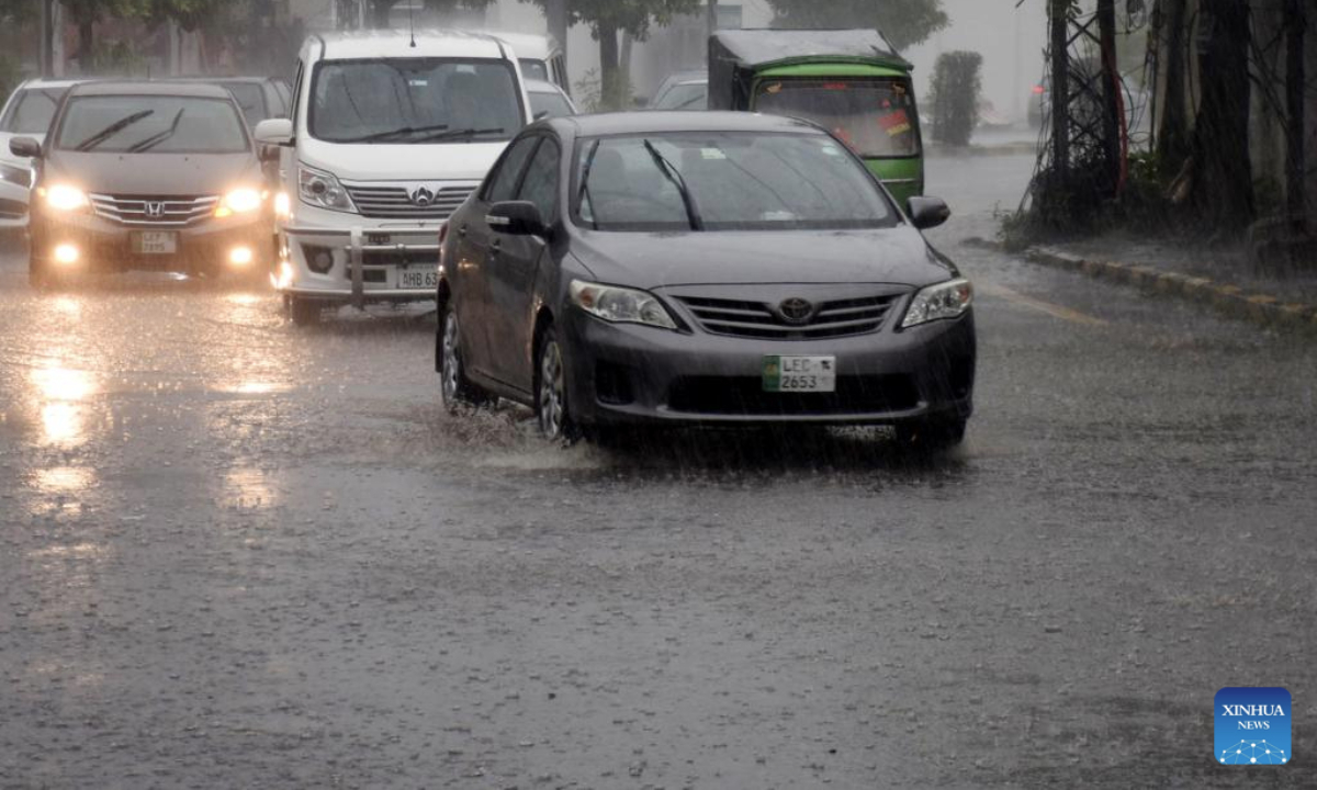 Vehicles wade through floodwater in a street after heavy monsoon rain in Lahore, Pakistan on July 9, 2025. (Photo by Sajjad/Xinhua)