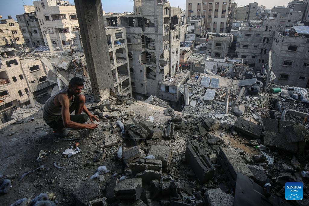 A Palestinian inspects a destroyed house after an Israeli airstrike in the al-Shati refugee camp, west of Gaza City, on July 4, 2025. (Photo: Xinhua)