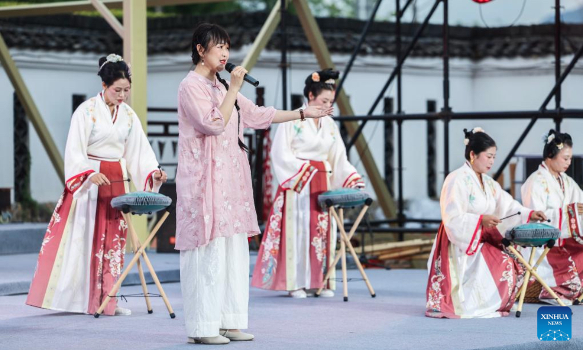 Villagers from a local musical school perform during the village summer musical season in Sandu Township, Jiande City, east China's Zhejiang Province, July 11, 2025. (Xinhua/Xu Yu)