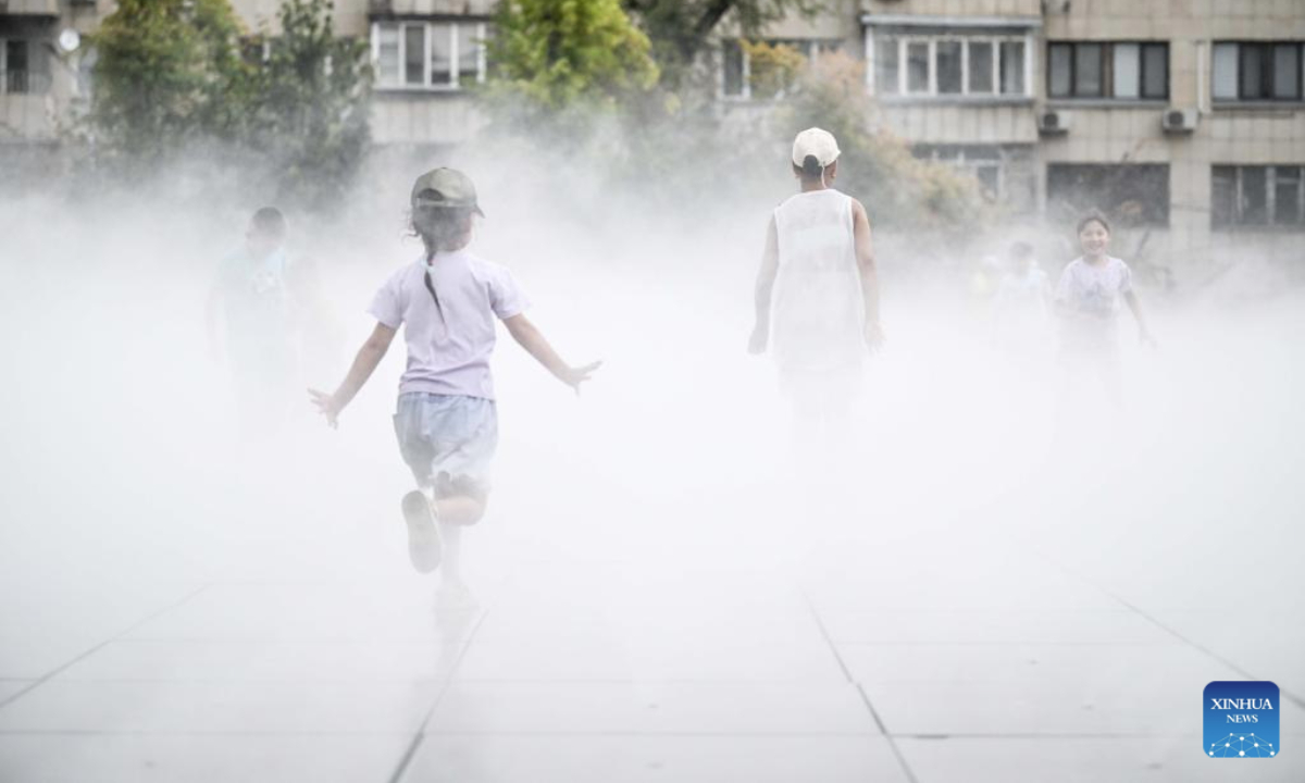 Children play at a plaza equipped with mist cooling devices in Almaty, Kazakhstan on July 27, 2025. Recently, the southern part of Kazakhstan, including the city of Almaty, Almaty region and South Kazakhstan region, has been hit by high heat waves. (Xinhua/Li Renzi)
