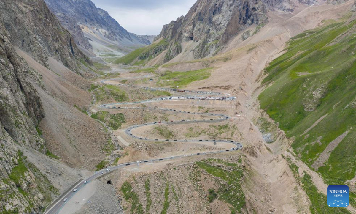 An aerial drone photo taken on July 15, 2025 shows a section of the Duku Highway in northwest China's Xinjiang Uygur Autonomous Region. Northwest China's Duku Highway, considered one of the most scenic roads in the country, sees a tourism boom in the summer.

The 561-kilometer highway connects Dushanzi in the north of Xinjiang with Kuqa City in the south, running through varied landscapes that include canyons, glaciers, lakes and grasslands. (Xinhua/Zhang Keren)