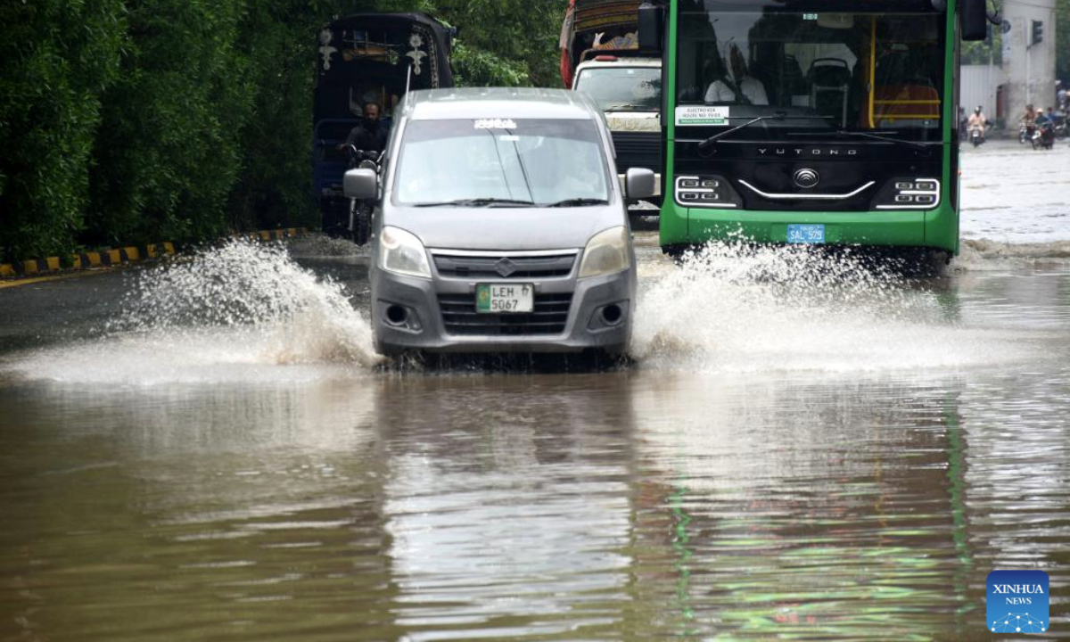 Vehicles wade through floodwater in a street after heavy monsoon rain in Lahore, Pakistan on July 9, 2025. (Photo by Sajjad/Xinhua)
