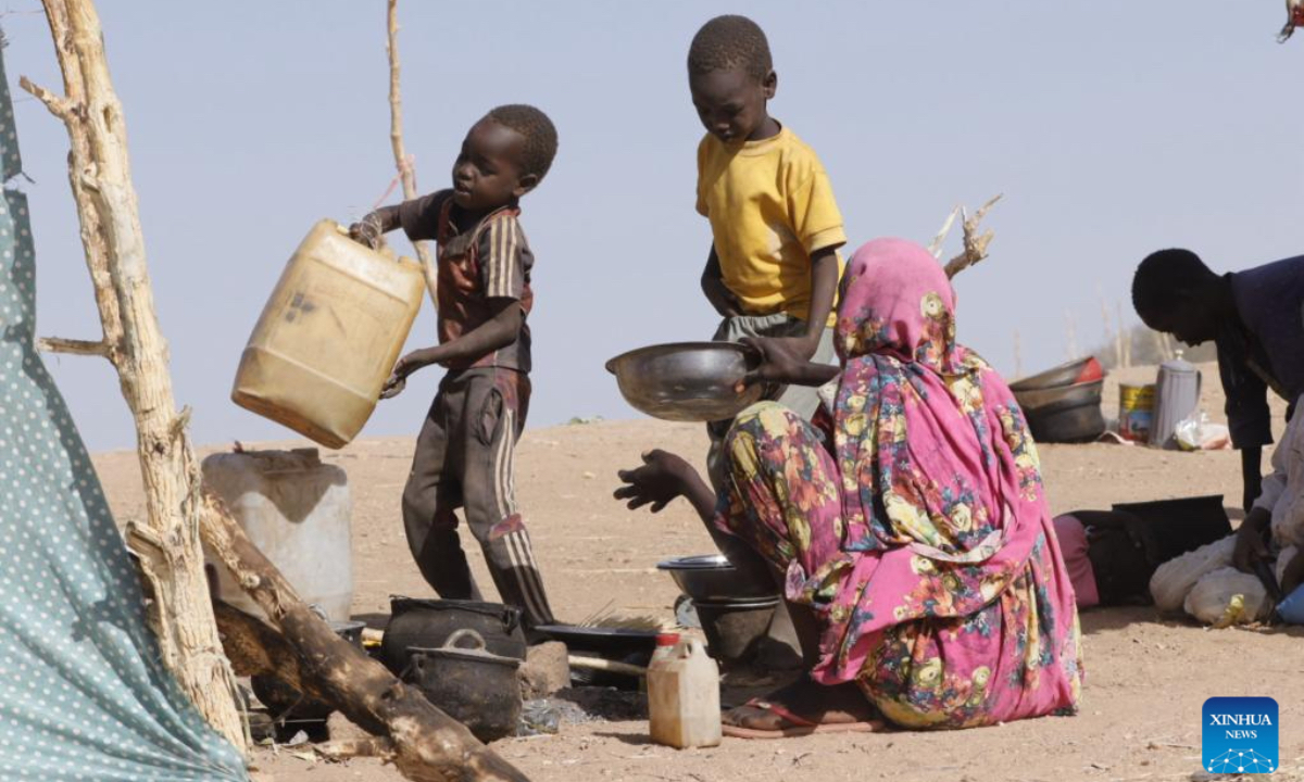 Children help to prepare food at a displacement camp in El Fasher, North Darfur region, Sudan, on July 9, 2025. The United Nations Children's Fund (UNICEF) said Friday that the number of children suffering from severe acute malnutrition (SAM) in Sudan's North Darfur region has doubled as a result of the country's ongoing military conflict. (UNICEF/Handout via Xinhua)