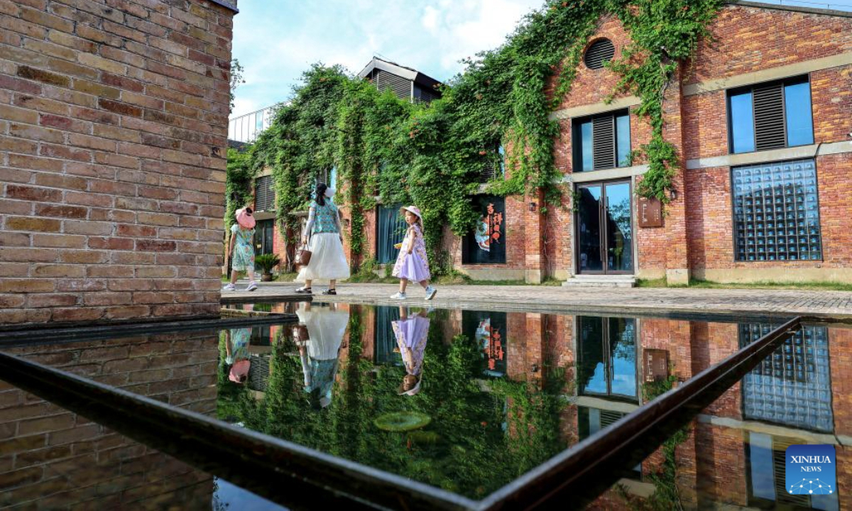 Tourists visit Taoyangli historical and cultural block in Jingdezhen City, east China's Jiangxi Province, July 13, 2025. Located in the heart of Jingdezhen, Taoyangli has successfully transformed from an old district into a thriving hub for cultural innovation and tourism in recent years. Today, it has become a must-visit destination for tourists. (Xinhua/Liu Jinhai)