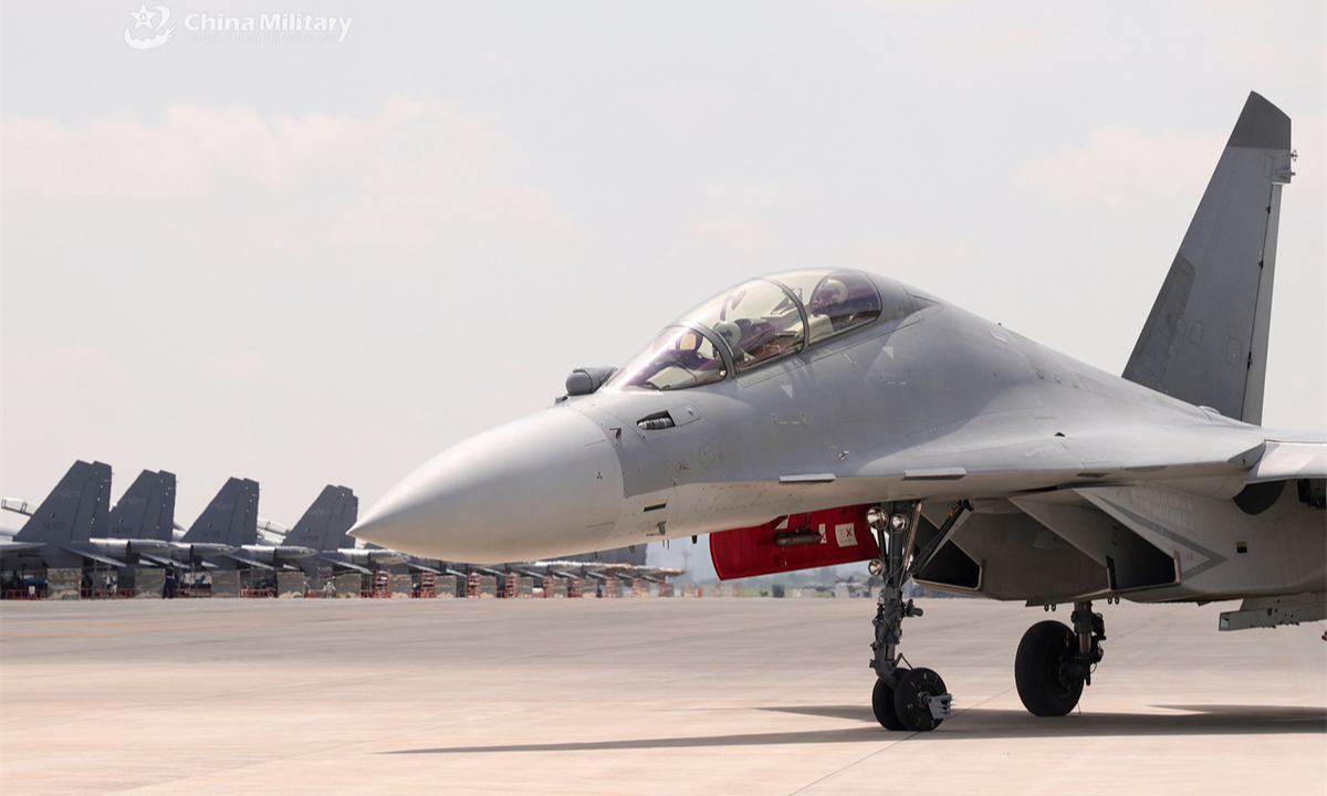 A J-16 multi-role fighter jet attached to an aviation brigade under the Chinese PLA Air Force taxis on the runway before taking off for a flight training exercise. (eng.chinamil.com.cn/Photo by Zhang Weishan)