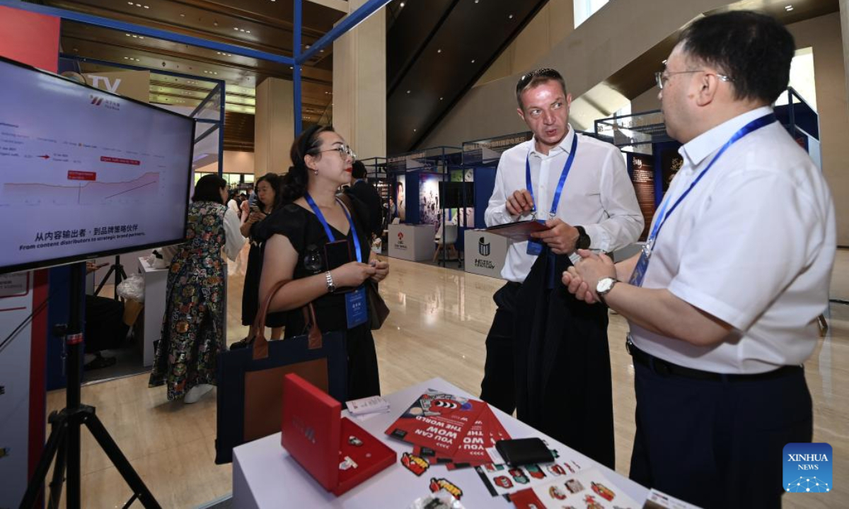 Representatives visit the booth of YoyWow during the 2nd television festival of Shanghai Cooperation Organization (SCO) countries in Xi'an, northwest China's Shaanxi Province, July 16, 2025. The festival opened here on Wednesday. About 300 representatives from the SCO member states, observer states and dialogue partners attended the opening ceremony. (Xinhua/Li Yibo)
