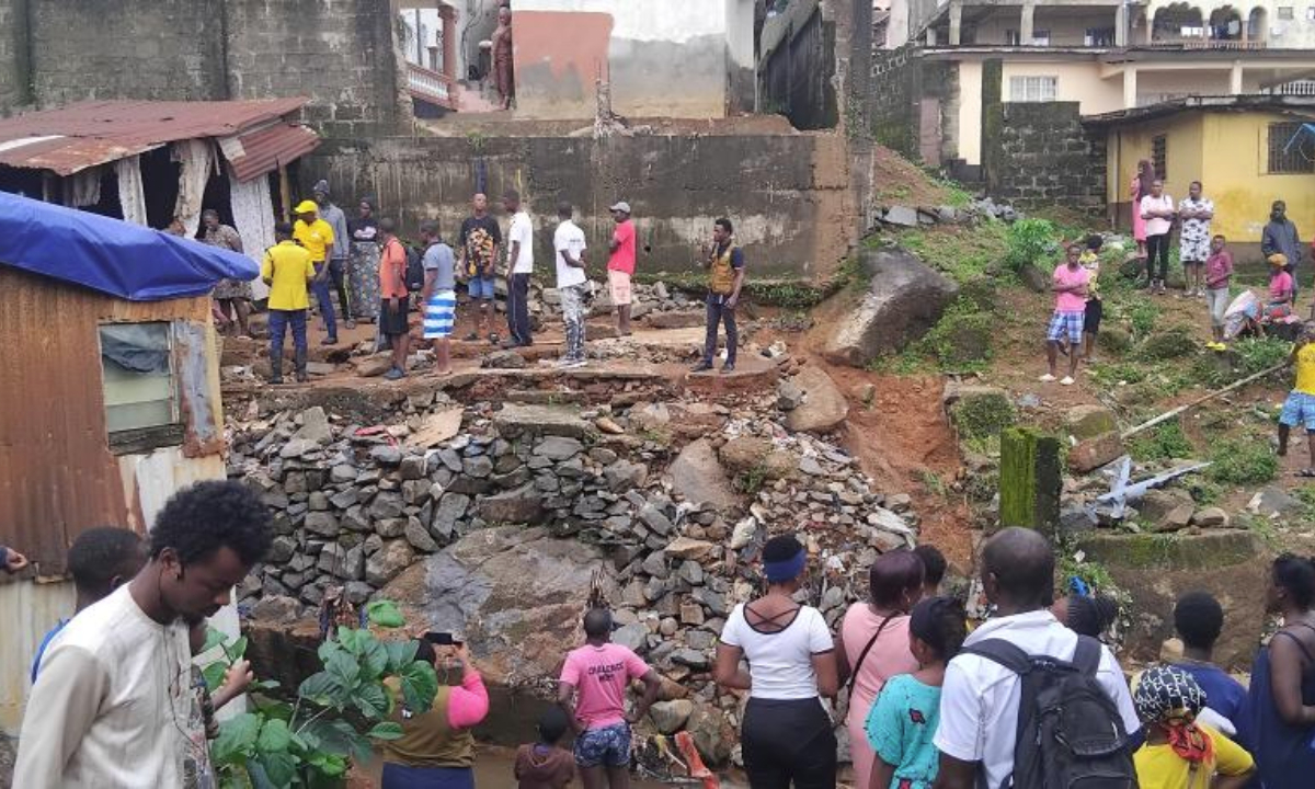 People check the disaster-stricken site in Freetown, Sierra Leone, July 24, 2025. Four people have been confirmed dead and hundreds left homeless following a devastating downpour late Wednesday in Sierra Leone, according to the National Disaster Management Agency (NDMA). (Photo by Morrie Koroma/Xinhua)