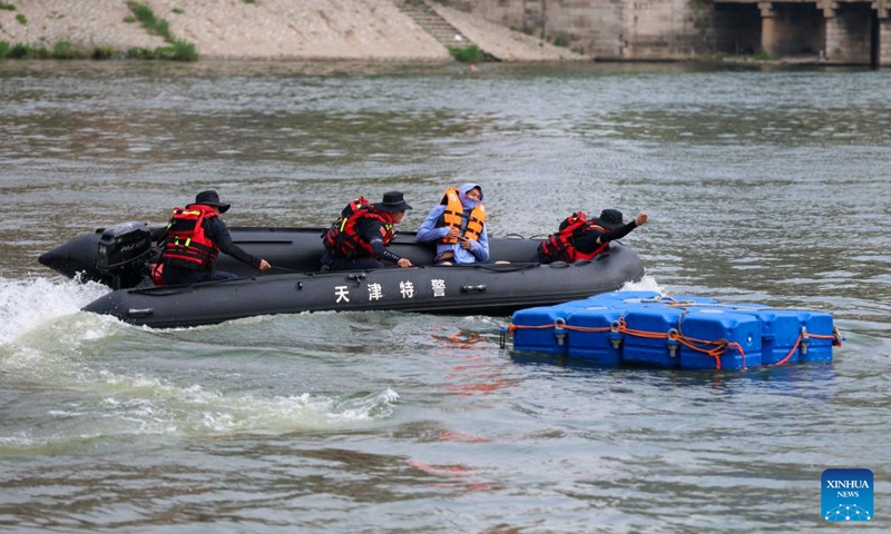 Rescuers participate in a flood rescue drill on Haihe River in north China's Tianjin, on July 5, 2025. The drill was set against potential flooding in culverts and low-lying urban areas affected by heavy rainfall. (Photo: Xinhua)