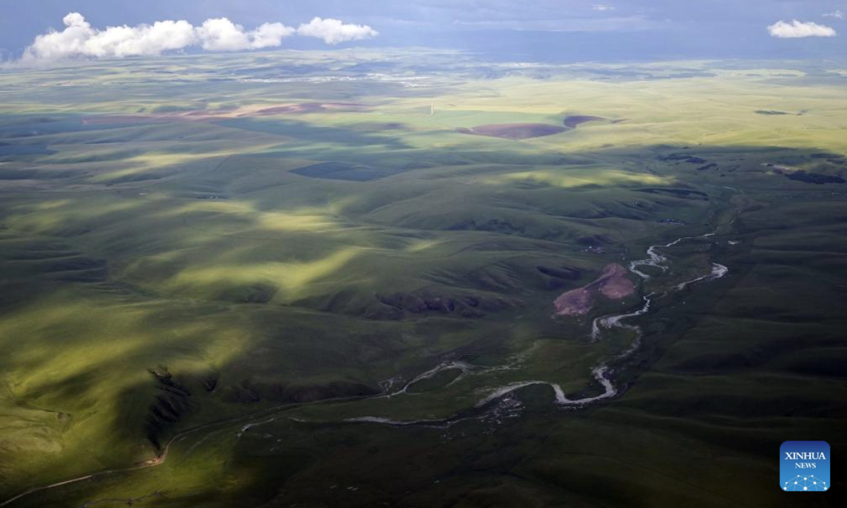 This aerial photo taken with a mobile phone shows a river running through a grassland in Hulun Buir, north China's Inner Mongolia Autonomous Region, July 29, 2025. (Xinhua/Jia Lijun)