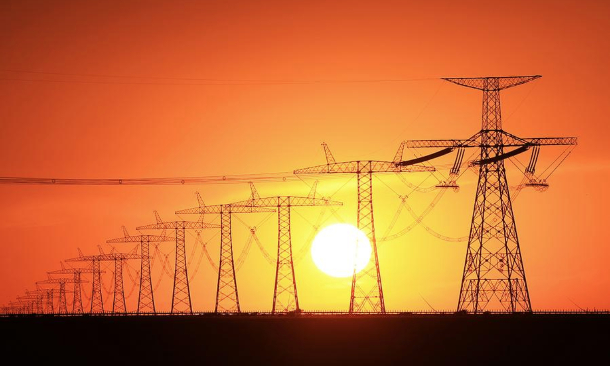 This photo taken on July 5, 2025 shows power lines of the Changji-Guquan ±1100 kV ultra-high voltage direct current power transmission project in the Kazak Autonomous County of Mori, northwest China's Xinjiang Uygur Autonomous Region. Xinjiang is a key sending hub in China's west-to-east power transmission program. (Photo by Zhang Limin/Xinhua)