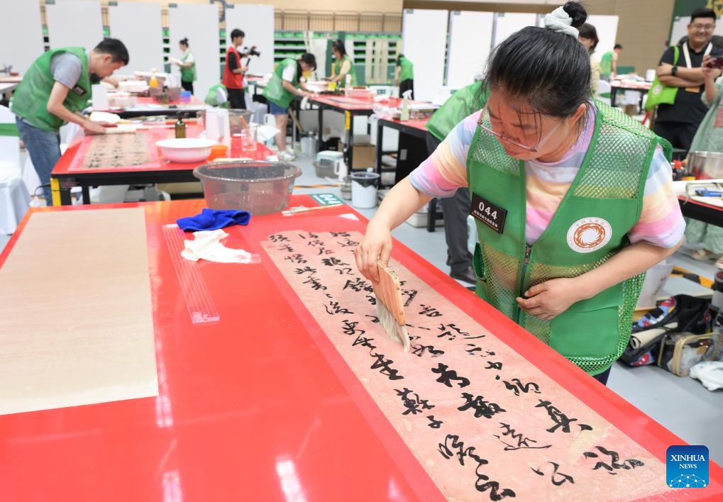 Contestants compete in paper calligraphy and painting relic restoration during the 2nd National Cultural Heritage Vocational Skills Competition in Luzhou City, southwest China's Sichuan Province, July 4, 2025. Starting from July 3, the four-day event attracted nearly 300 contestants competing in six categories. (Photo: Xinhua)