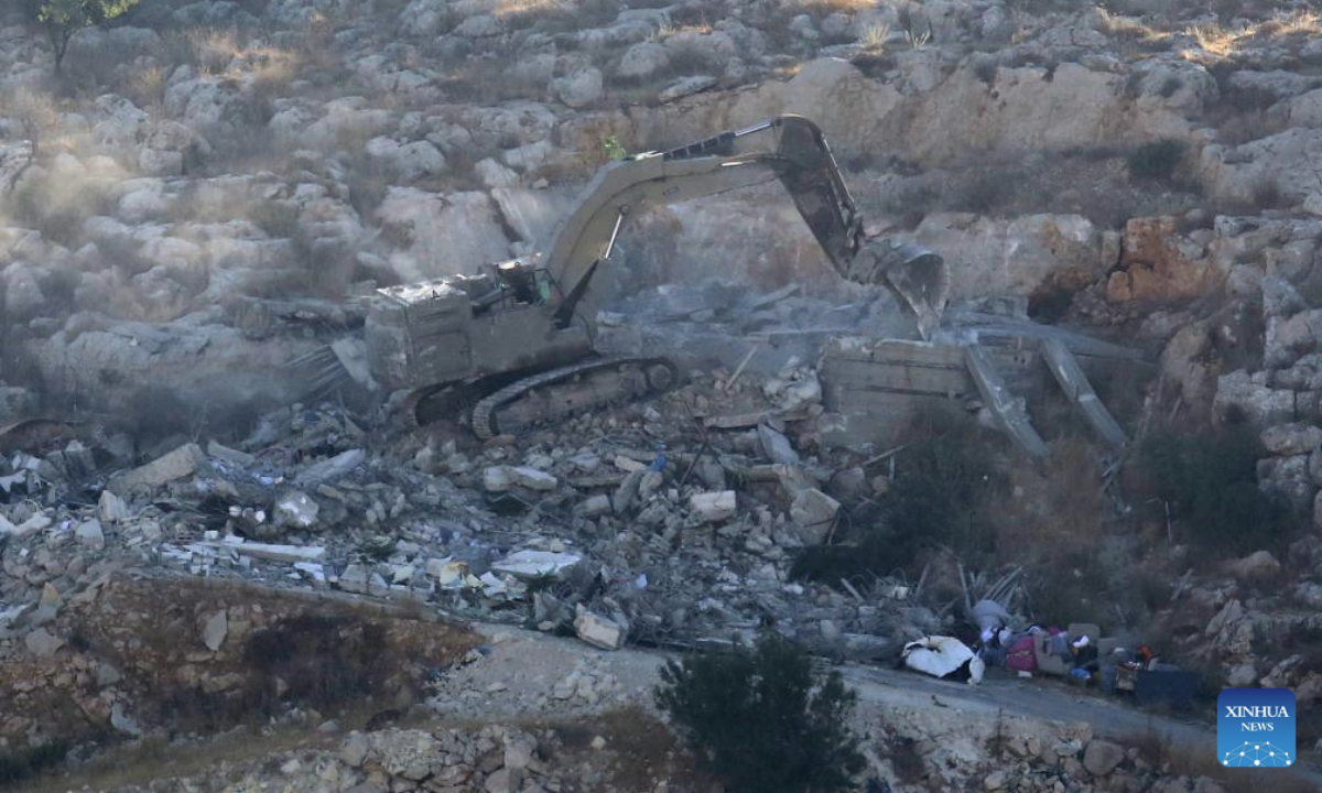 An Israeli excavator demolishes a Palestinian house, in the town of Rujeib, east of the West Bank city of Nablus, on July 9, 2025. (Photo by Nidal Eshtayeh/Xinhua)