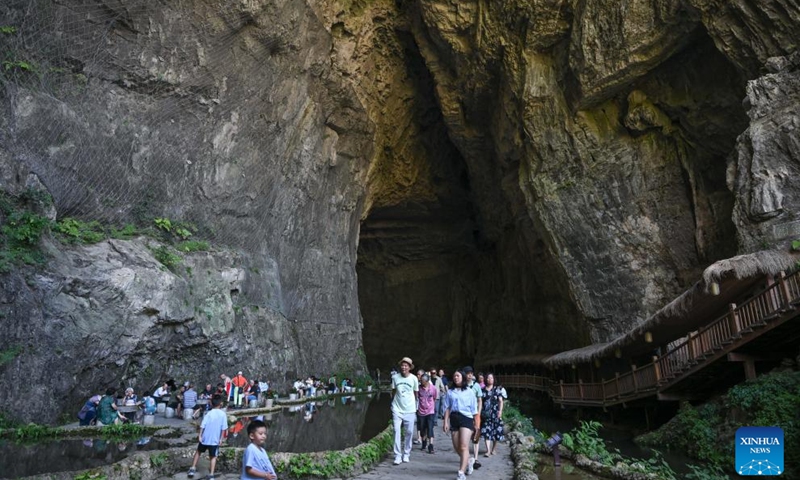Tourists visit the Taohuayuan scenic spot in Youyang Tujia and Miao Autonomous County, southwest China's Chongqing Municipality, July 5, 2025. (Photo: Xinhua)
