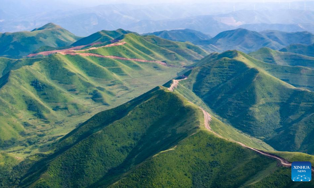 A drone photo taken on July 17, 2025 shows the Madong Mountain forest farm blanketed in lush green vegetation in Yuanzhou District of Guyuan City, northwest China's Ningxia Hui Autonomous Region. In recent years, Ningxia has leveraged major national ecological projects such as