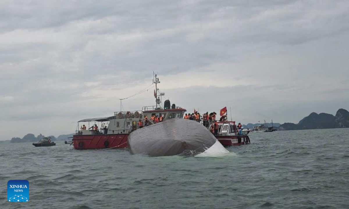 Rescuers work at the capsizing site of a cruise ship in Ha Long Bay, northern Vietnam's Quang Ninh province, July 19, 2025. At least three people have been confirmed dead and 10 others rescued after a cruise ship capsized in Ha Long Bay, northern Vietnam's Quang Ninh province, on Saturday afternoon, due to strong wind and rough sea, Vietnam News Agency reported. (VNA/Handout via Xinhua) 