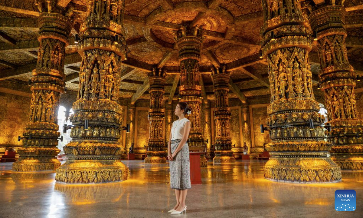 A tourist visits the Lao Art Museum in Vientiane, Laos, July 13, 2025. The Lao Art Museum features an array of traditional Lao woodcarvings, highlighting the intricate craftsmanship that is a cornerstone of the nation's cultural identity. It also provides a platform to showcase creativity across generations, promoting sustainability, environmental awareness, and cultural preservation. (Photo by Kaikeo Saiyasane/Xinhua)