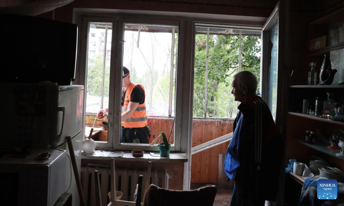 People check the damage after a Russian attack in the Sviatoshinskyi District of Kiev, Ukraine, on July 31, 2025. (Xinhua/Li Dongxu)
