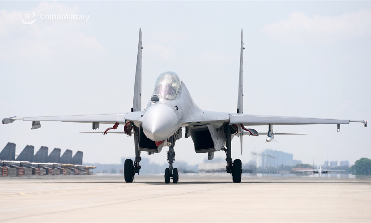 A J-16 multi-role fighter jet attached to an aviation brigade under the Chinese PLA Air Force taxis on the runway after completing a flight training exercise. (eng.chinamil.com.cn/Photo by Zhang Weishan)