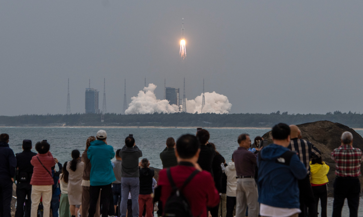 Crowds gather at the Wenchang Space Launch Site in South China's Hainan Province to witness the ignition and liftoff of the Long March-8 Y3 carrier rocket on March 20, 2024. Photo: VCG