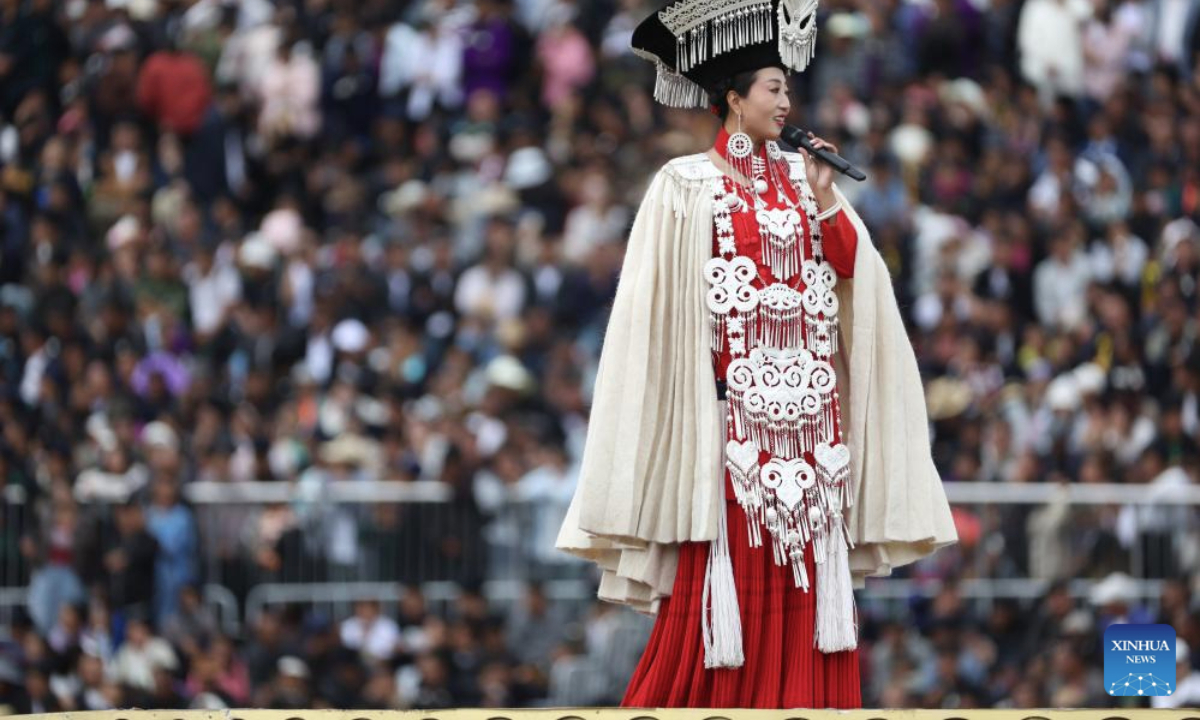 A singer of Yi ethnic group performs on the opening ceremony of a torch festival in Butuo County, southwest China's Sichuan Province, July 22, 2025. A traditional torch festival of Yi ethnic group was staged from July 21 to 23 here, which featured various activities including costume displays, campfire party, traditional ethnic sports events, dancing and traditional beauty contest to attract visitors from across the country. (Xinhua/Jiang Hongjing)