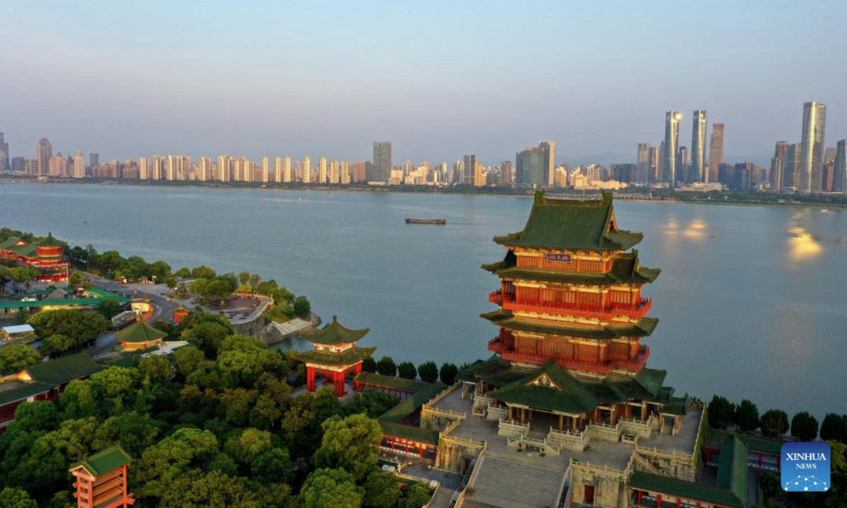 An aerial drone photo taken on July 7, 2025 shows a view of the Tengwang Pavilion scenic area in the morning light in Nanchang City, east China's Jiangxi Province. The Tengwang Pavilion, the 29th iteration in its 1,400-year history, features intricately carved beams and vibrantly painted rafters. It stands majestically along the banks of the Ganjiang River, which winds through eastern China's Jiangxi Province. About 90 percent of the scenic area has been open to the public for free as of Jan. 1 this year when a northward expansion project was fully completed. (Xinhua/Liu Jinhai)