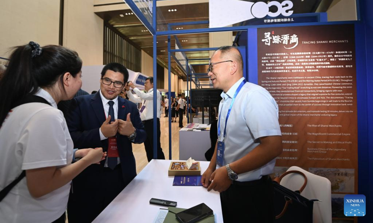 Representatives learn about the audio-visual products of Shanxi Radio and Television Station during the 2nd television festival of Shanghai Cooperation Organization (SCO) countries in Xi'an, northwest China's Shaanxi Province, July 16, 2025. The festival opened here on Wednesday. About 300 representatives from the SCO member states, observer states and dialogue partners attended the opening ceremony. (Xinhua/Li Yibo)