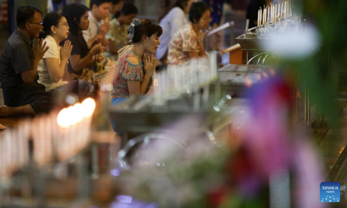 People pay homage during the full moon day of Warso, the fourth month of Myanmar calendar, at the Koe Htat Gyi Pagoda in Yangon, Myanmar, July 9, 2025. (Xinhua/Myo Kyaw Soe)