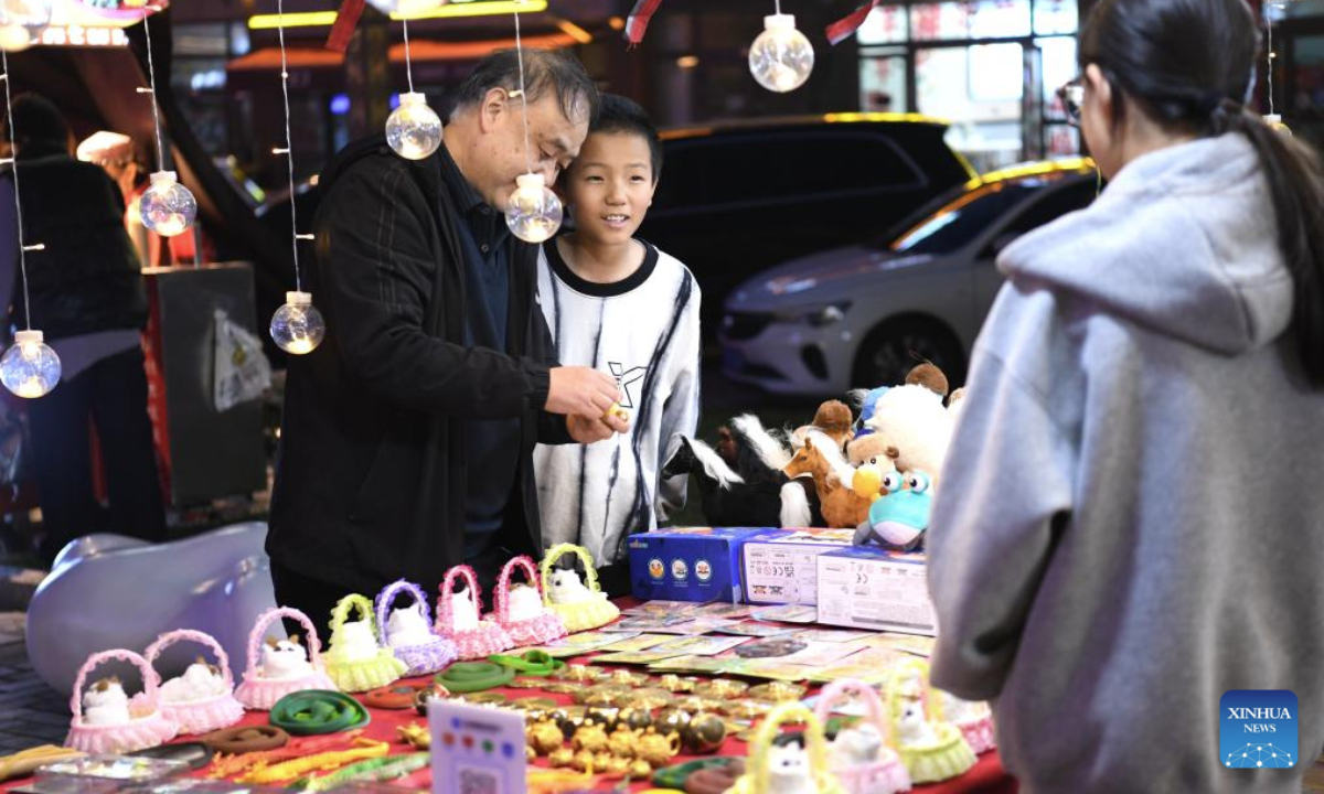 A boy inquires about prices at a stall of the Tianma tourism block in Zhaosu County of Ili Kazak Autonomous Prefecture, northwest China's Xinjiang Uygur Autonomous Region on July 17, 2025. The renovation of the Tianma tourism block in Zhaosu County is a key project in the pairing assistance program of east China's Jiangsu Province for Yili Prefecture. Kicked off on March 11, 2025, the project is now fundamentlly completed.

In addition to offering better experience to tourists, the renovation work also brings more job opportunities to the locals. (Xinhua/Xie Xiudong)