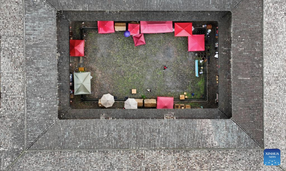 An aerial drone photo taken on June 19, 2025 shows a Hakka walled complex in Yangcun Town of Longnan, east China's Jiangxi Province. Longnan City in southern Jiangxi is home to 376 Hakka walled complexes, a special architectural type, accounting for more than 70 percent of all such structures in Gannan (southern Jiangxi Province). The whole structure of the building resembles a small fortified city, containing halls, storehouses and living areas. In recent years, Longnan City has launched a systematic preservation initiative, investing 150 million yuan (about 20.89 million U.S. dollars) to protect and restore these historical complexes. Up until now, the repair of 92 Hakka walled villages has been completed. These sites have transcended their roles as cultural relics, evolving into engines powering the city's cultural tourism and rural revitalization. In the first four months of this year, Longnan received 3.33 million tourists. (Xinhua/Wan Xiang)
